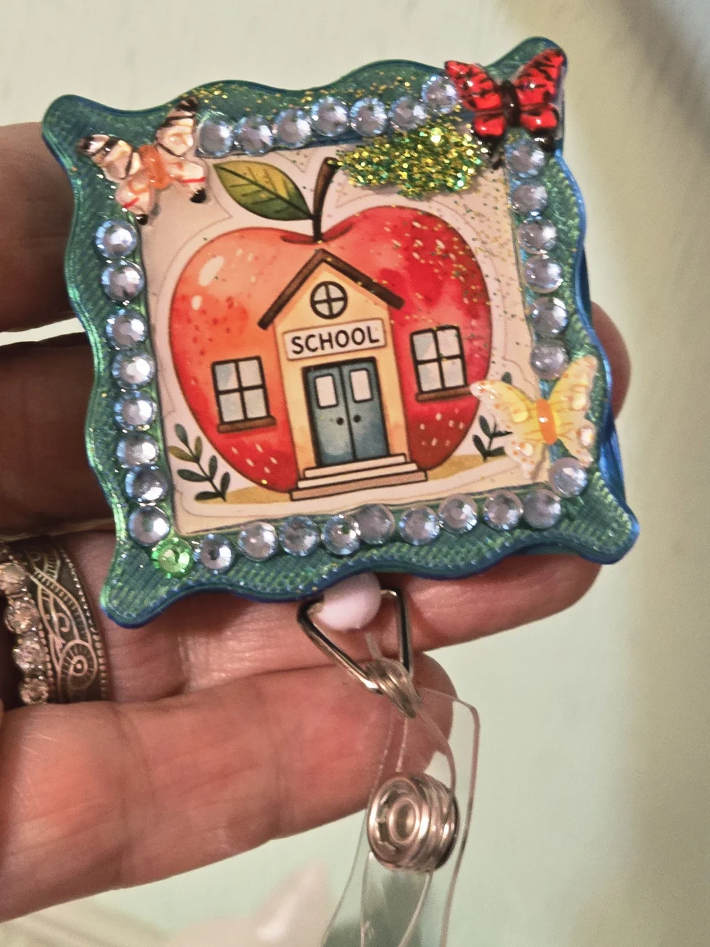 Handcrafted School Apple Badge Reel — Teal, Red, Yellow Accents